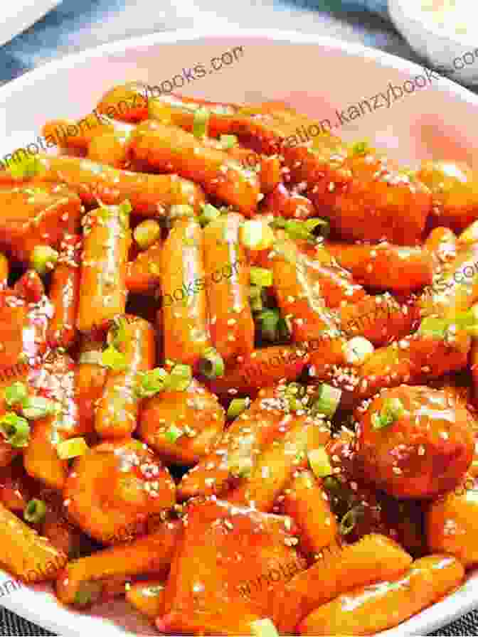 A Bowl Of Tteokbokki, Featuring Chewy Rice Cakes Coated In A Spicy And Savory Sauce. KOREAN FOODS IN WINTER YOU CAN NOT MISS